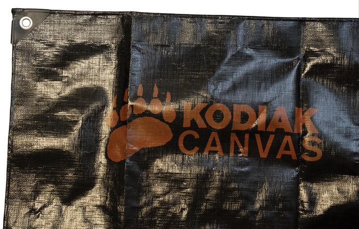 Kodiak Canvas heavy-duty black tarp with logo, durable material for outdoor use and protection.