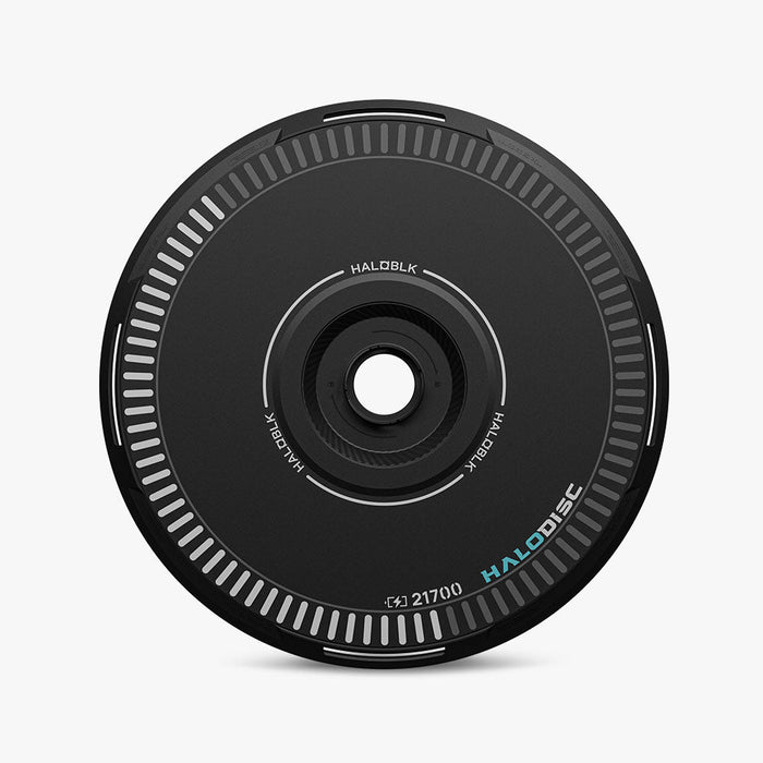 A black, circular HALODISC 2 Replacement Wheel Cover by HALOBLK Store for Tesla Model Y, featuring white edge markings, a central hole, and the words HALOBLK and HALODISC printed on the surface.