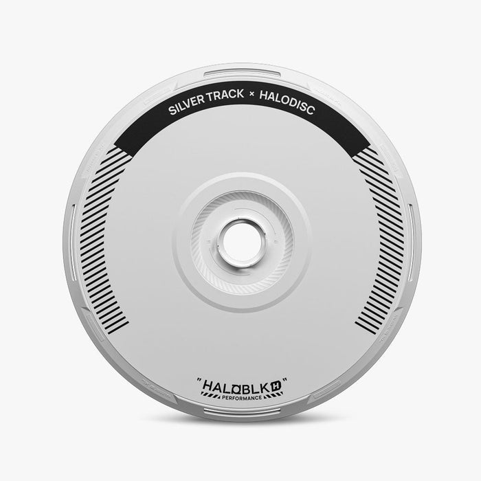 A silver disc with black detailing and text "SILVER TRACK × HALODISC" at the top and "HALOBLK PERFORMANCE" at the bottom, shown on a white background. Product: HALODISC 2 Replacement Wheel Covers for Tesla Model Y Juniper｜Silver Track by HALOBLK Store.