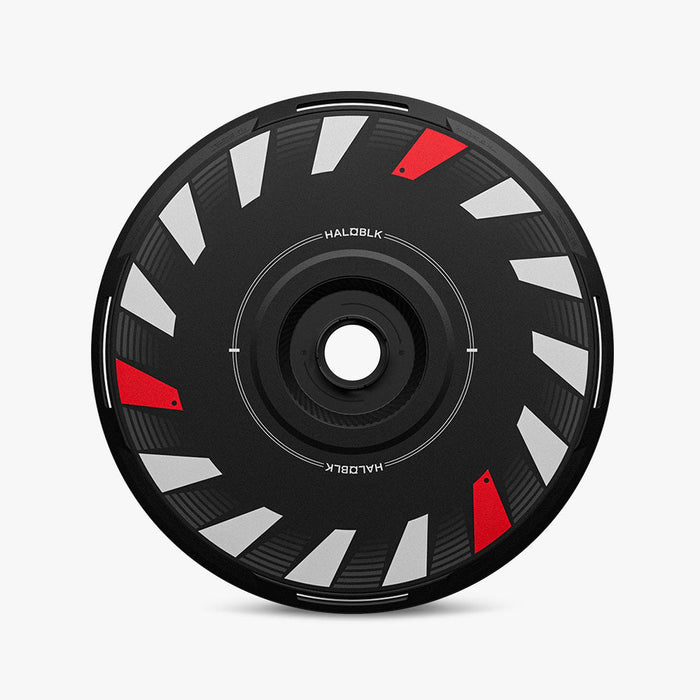 The HALODISC 2 Replacement Wheel Cover for Tesla Model Y Juniper丨Turbo by HALOBLK Store features a black disc with white and red angular accents evenly spaced. "HALO BLK" appears twice along the inner circle, all shown on a plain white background.