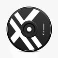 The HALODISC 2 Replacement Wheel Cover by HALOBLK Store for Tesla Model Y Juniper X-Factor is a black disc wheel with bold white diagonal stripes, X design, and "XMCOUND" near the edge, displayed on a plain white background.