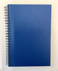 Blue spiral-bound notebook on a white background