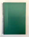 Green spiral-bound notebook on a white background