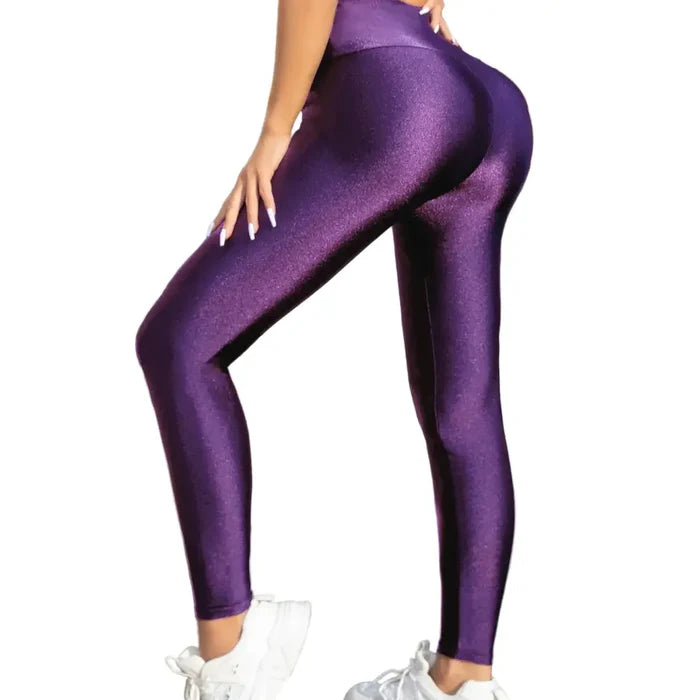 High-waisted purple gloss leggings for women by Habicare, featuring a shiny, form-fitting design perfect for activewear or casual style.