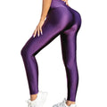 High-waisted purple gloss leggings for women by Habicare, featuring a shiny, form-fitting design perfect for activewear or casual style.