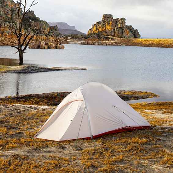 Mead's Supply & Equipment Outfitters hiking camping tent set up outdoors with rainfly and sleeping area, ideal for outdoor adventures.