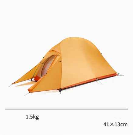 Mead's Supply & Equipment Outfitters hiking camping tent set up outdoors on a grassy area with trees in the background