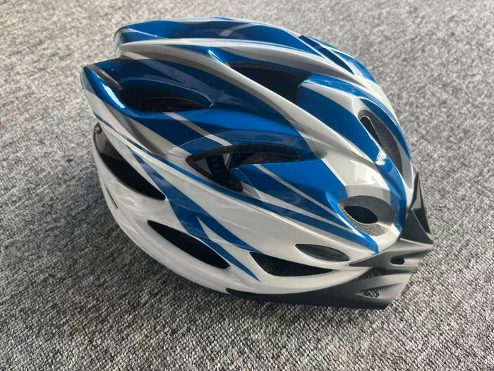 ECOTREK HT-12 lightweight bicycle helmet with adjustable fit and ventilation, shown in a natural outdoor cycling setting.