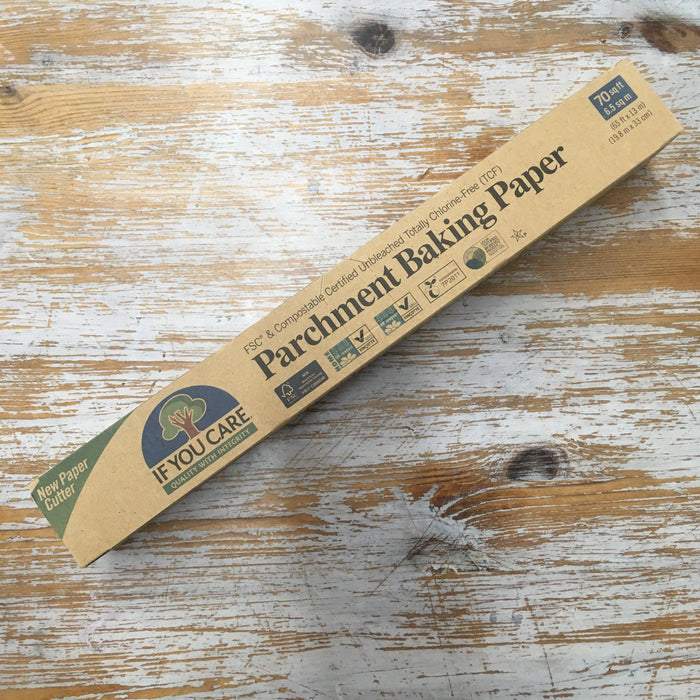 A pack of If You Care Parchment Baking Paper lying on a wooden surface.