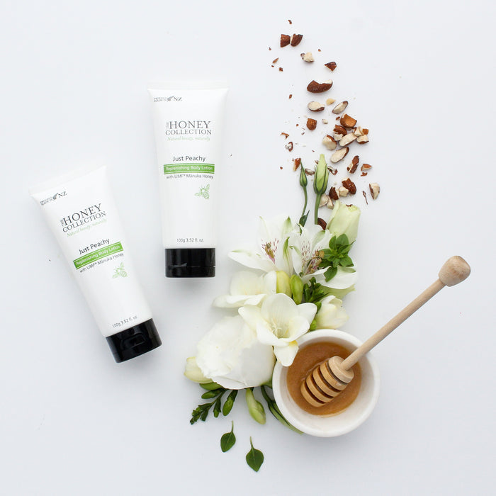 The Honey Collection Just Peachy Replenishing Body Lotion in a white pump bottle, showing peach and honey scent details.