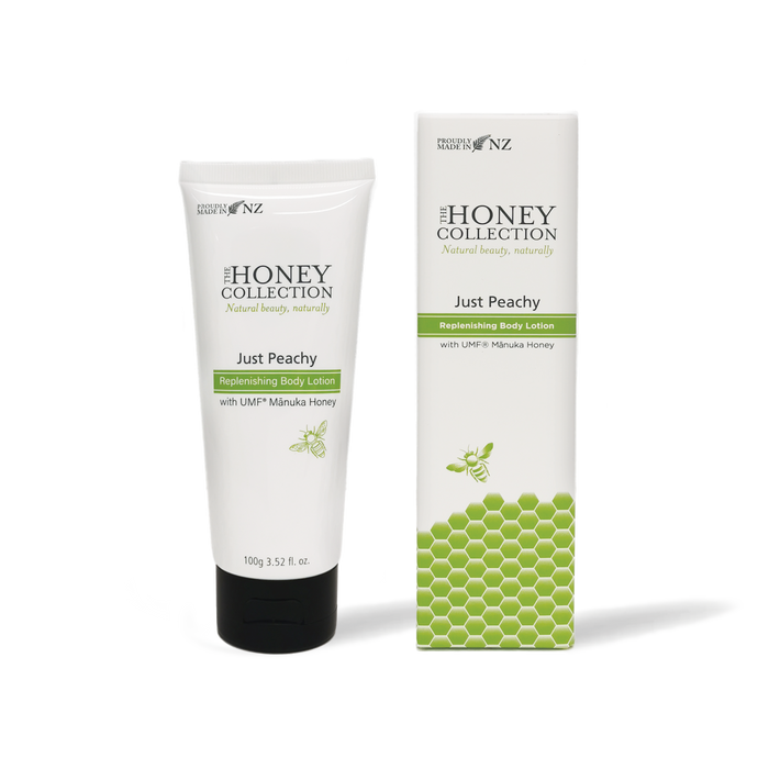 The Honey Collection Just Peachy Replenishing Body Lotion in a peach-colored box, showcasing the moisturizer bottle inside.