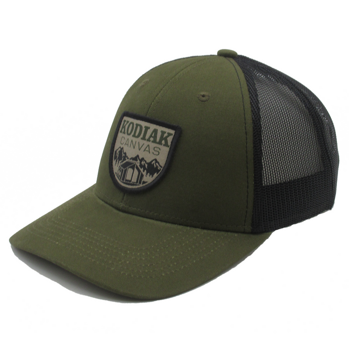 Olive green trucker hat with Kodiak Canvas logo, mesh back, and adjustable strap for comfort.