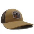 Brown Kodiak Canvas trucker hat with mesh back and mountain logo for outdoor adventures.
