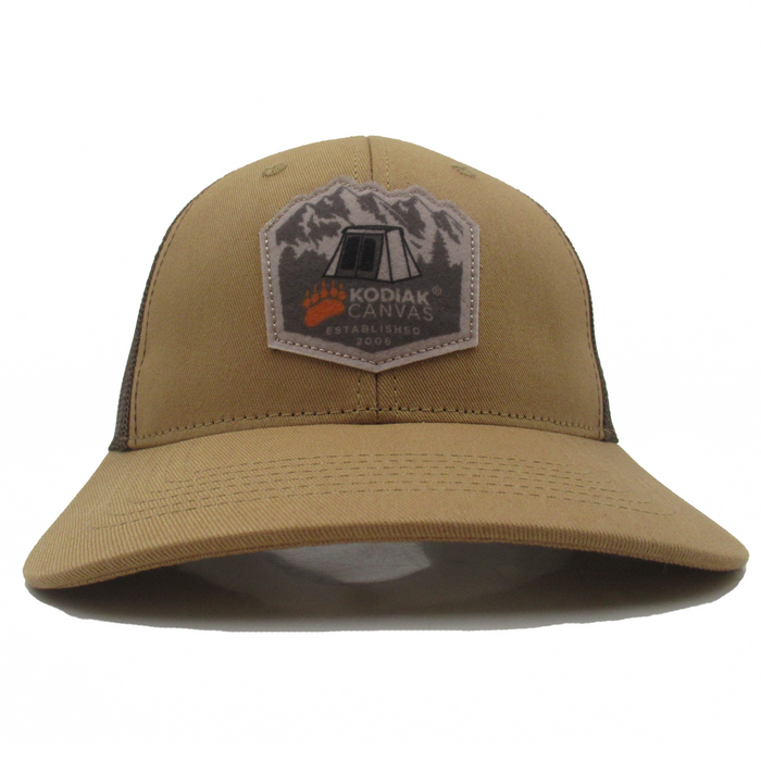 Kodiak Canvas tan cap with adjustable back, logo patch, perfect for outdoor adventures.