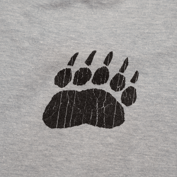 Gray t-shirt featuring a black cracked bear paw print design, perfect for wildlife lovers.