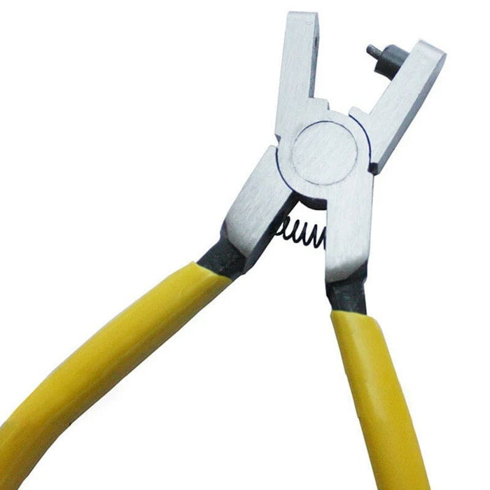 White leather hole punch tool for watch straps and belts, featuring pair pliers for precise hole making, from That Watch Shop.
