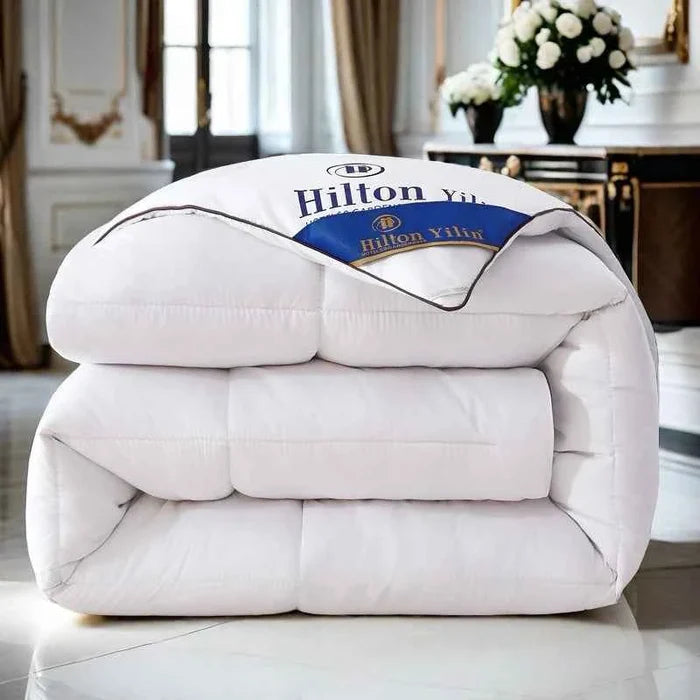 Luxurious Hilton Hotel down duvet inners for cozy comfort, soft white filling with a smooth, plush fabric cover.