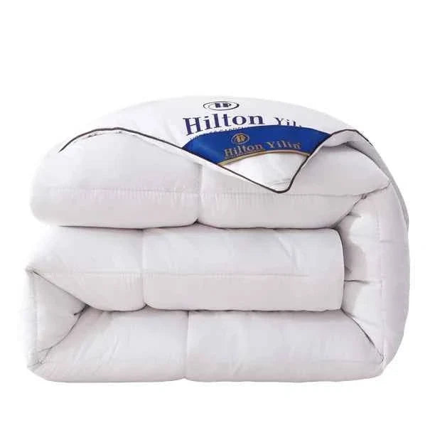 Luxurious Hilton Hotel down comforter duvet inners from ShopHub NZ, plush and cozy for restful sleep in a soft, white fabric.