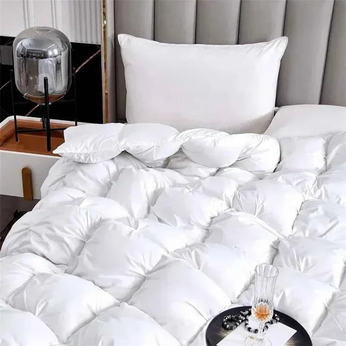 White goose down quilt from ShopHub NZ, showcasing its plush, lightweight fabric and cozy, luxurious design for ultimate warmth and comfort.