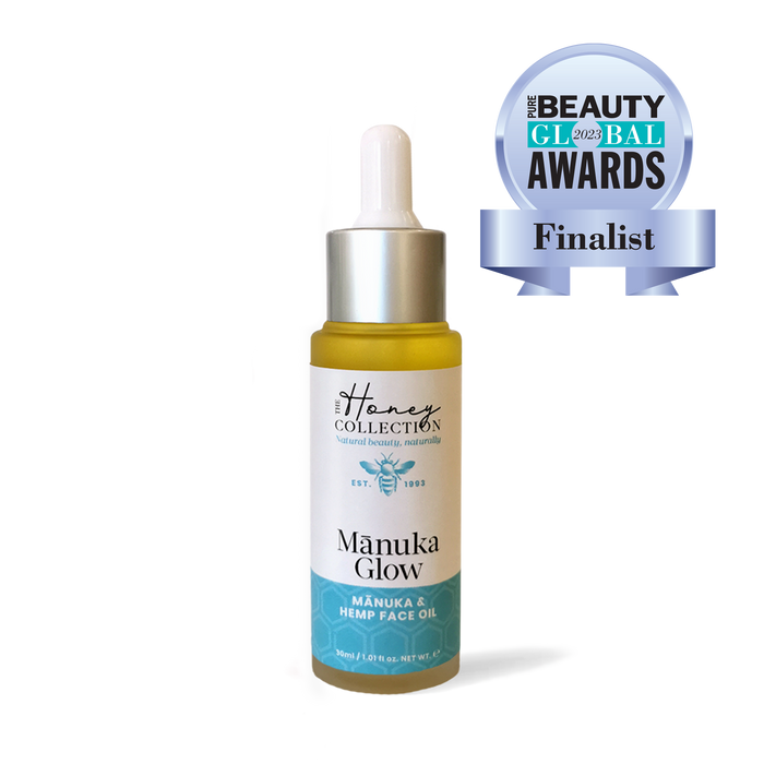Bottle of Manuka Glow face oil by The Honey Collection, 30ml, with natural ingredients in a clear glass bottle.