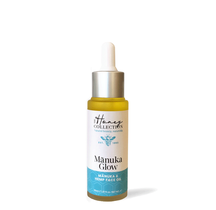 Open bottle of Manuka Glow face oil by The Honey Collection, showcasing the natural, golden-colored face oil in a clear glass bottle.