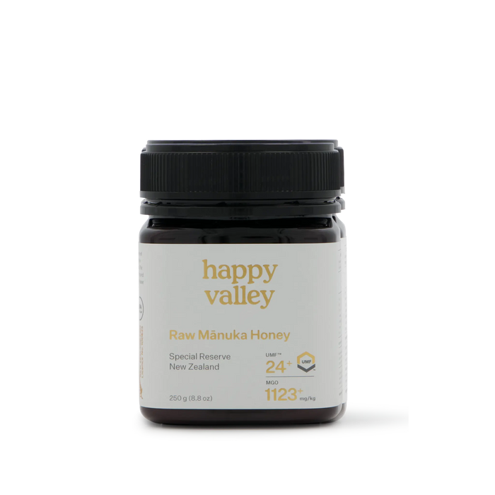Jar of Happy Valley Honey Mānuka Honey UMF® 24+ with golden color and label, showcasing high-quality Manuka honey in a glass jar