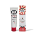 Manuka Magic remedial cream from The Honey Collection in a transparent jar with a golden lid, showcasing a smooth, natural cream texture.