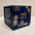 Navy blue packaging of mella's Irish Butter Fudge with gold floral designs on a white background