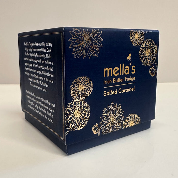 Navy blue packaging of mella's Irish Butter Fudge with gold floral designs on a white background