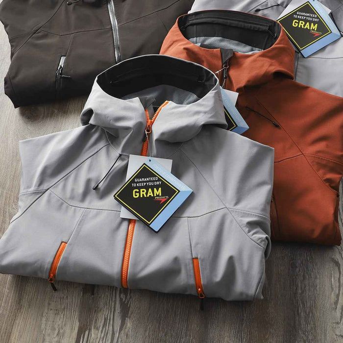 Men's waterproof softshell jacket from Mead's Supply & Equipment Outfitters, windproof hooded hiking shell, suitable for outdoor adventures.