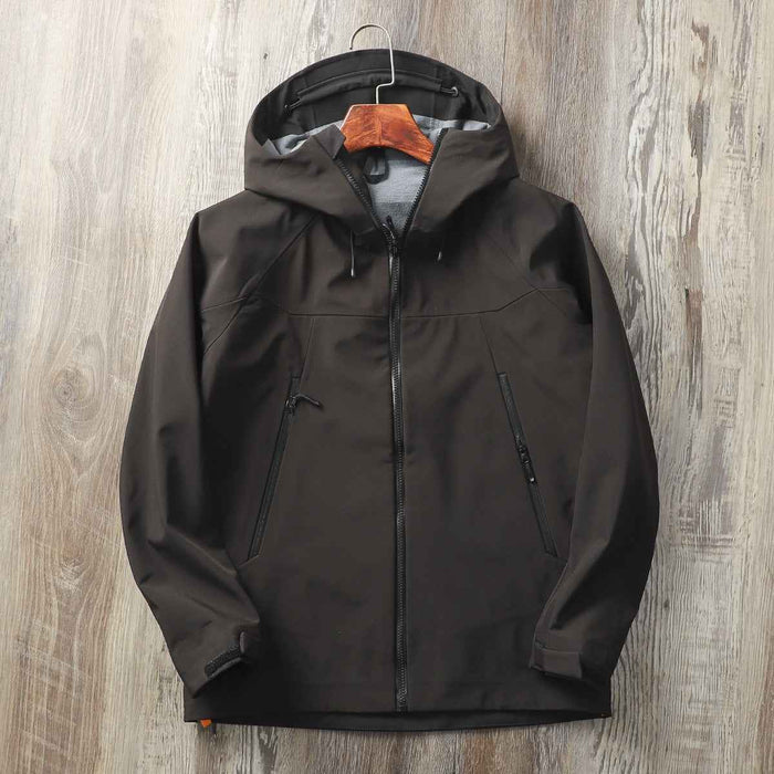 Men's waterproof softshell jacket from Mead's Supply & Equipment Outfitters, windproof, hooded hiking shell, suitable for outdoor activities.