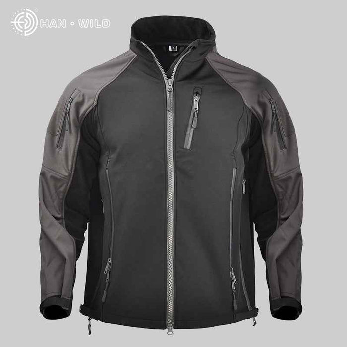 Men's waterproof tactical softshell jacket by Mead's Supply & Equipment Outfitters, shown in a rugged outdoors setting.