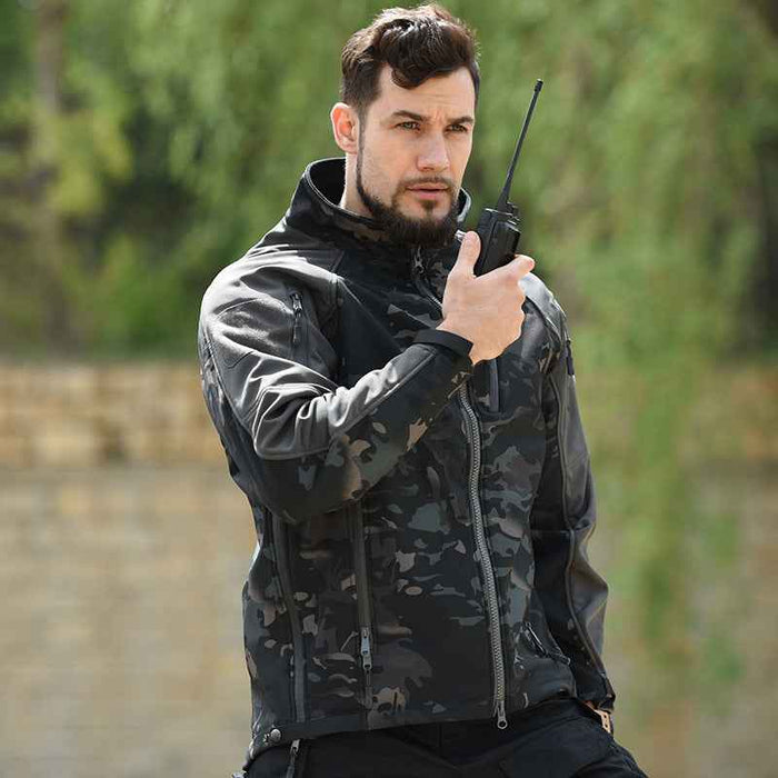 Men's waterproof tactical softshell jacket for fall and winter from Mead's Supply & Equipment Outfitters, showing front view with hood