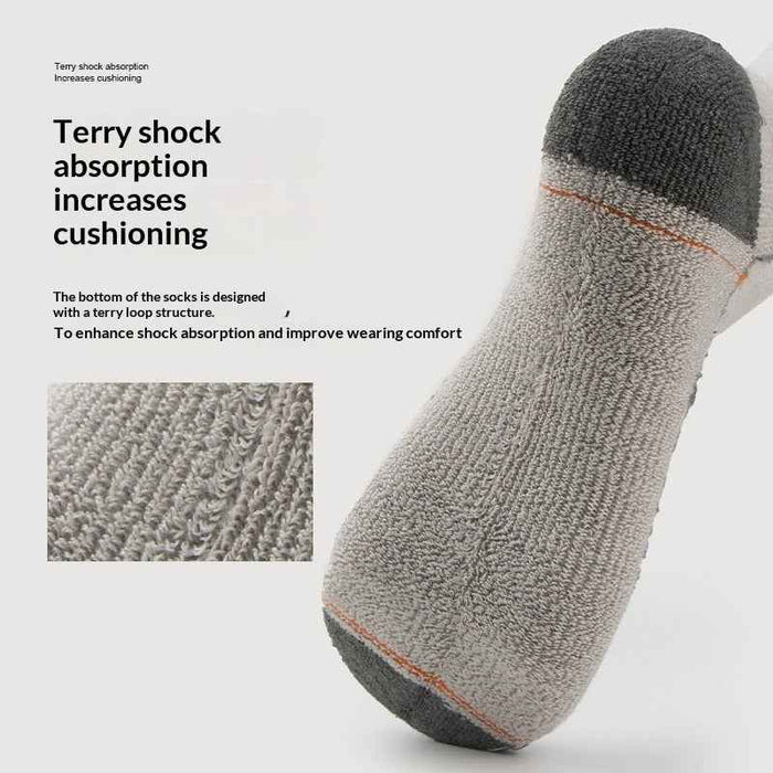 Pair of men's and women's tall wool socks from Mead's Supply & Equipment Outfitters, showing the cozy, thick knit fabric.