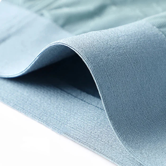 Set of three MiiOW men's breathable boxer shorts showing soft, comfortable fabric and relaxed fit in neutral colors.