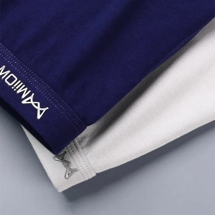 Three pairs of men's cotton boxer briefs from MiiOW, featuring comfortable fit and breathable fabric, in assorted colors.