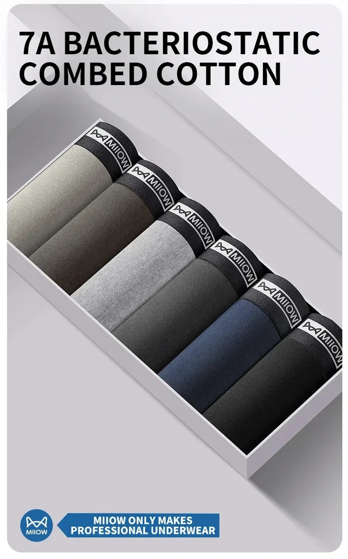 Set of four breathable MiiOW cotton men's boxer shorts with antibacterial fabric, shown in neutral colors on a plain background.