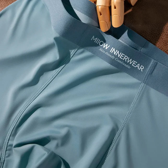 Set of three men's boxer shorts from MiiOW with silky smooth ice silk fabric and breathable comfort, available in various colors.