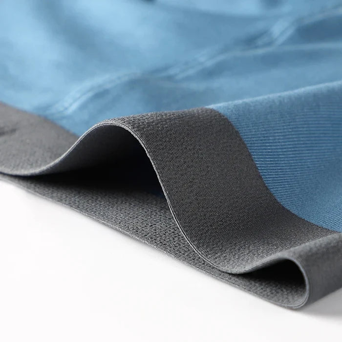 Three pairs of MiiOW men's boxer shorts made of breathable cotton with antibacterial crotch, featuring a silky smooth finish.