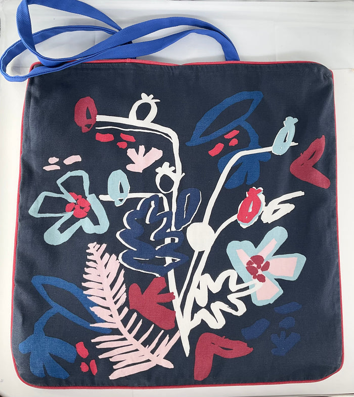 Navy blue bag with colorful floral design on a white background