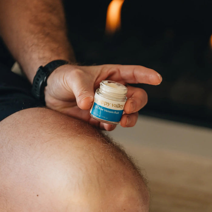 Bottle of Happy Valley Honey NZ Bee Venom Rub with label, showing bee venom product for skin relief.