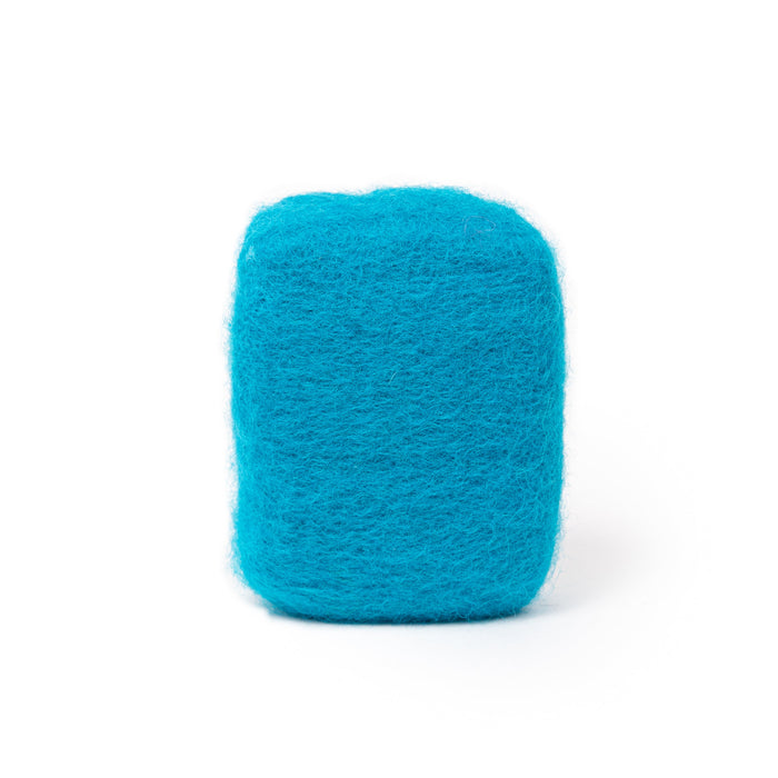 Ocean felted wool soap by Bruntwood Lane with a textured wool cover in ocean blue tones and a natural soap base.