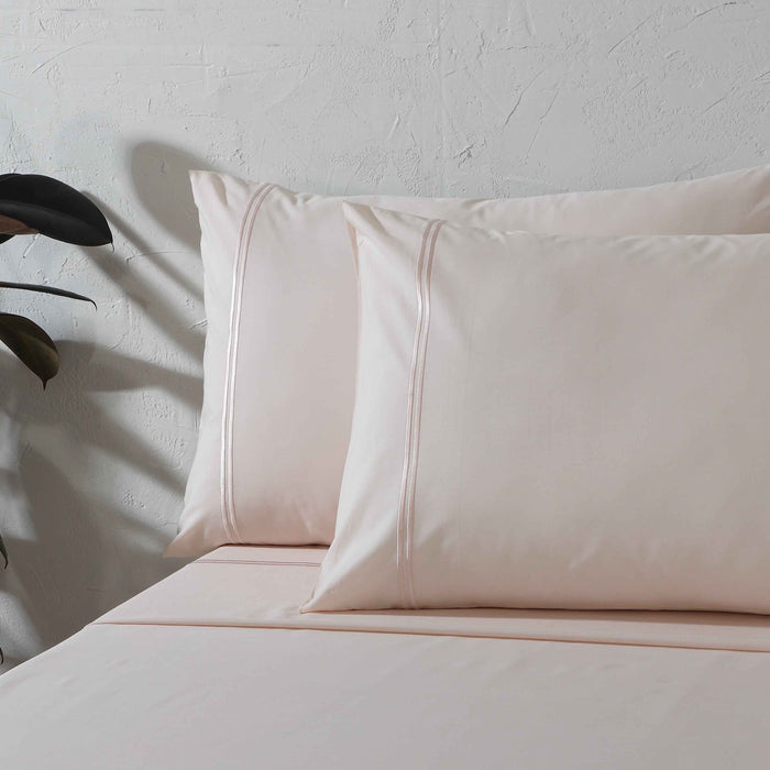 Organic cotton peach mist sheet set from Whites of London NZ, 250 thread count, includes fitted and flat sheets with pillowcases.