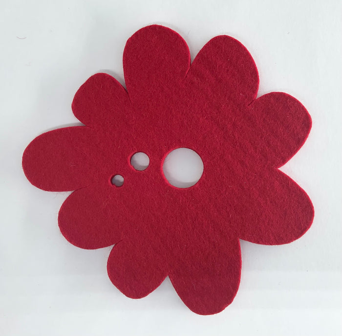 Red flower-shaped pot holder on a white background