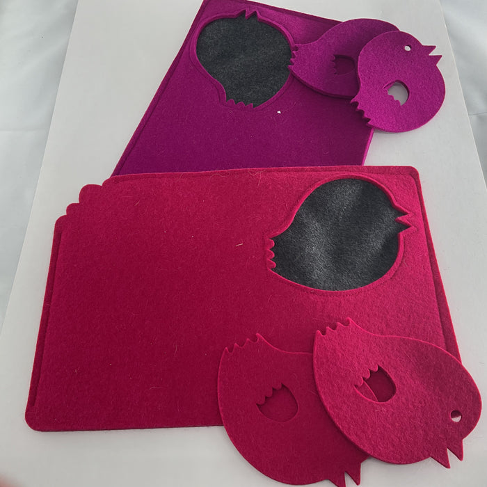 Purple and pink felt tea cosies and coasters on a white background