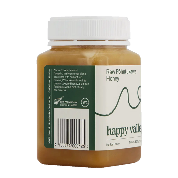 Side view of raw Pohutukawa native honey in a jar from Happy Valley Honey, showcasing its golden color and natural texture.