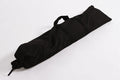 Black canvas carry bag with straps, perfect for transporting and storing various gear.