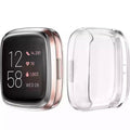 Clear protective watch case for Fitbit Versa 1 by That Watch Shop, showing a snug fit around the smartwatch.