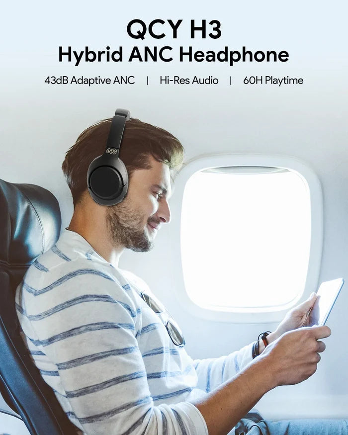 QCY H3 ANC wireless headphones with black earcups, ear tips, and inline controls, showcasing active noise cancellation and charging case
