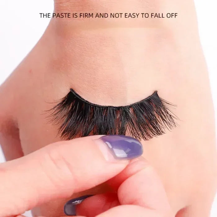 Quick Dry Eyelash Glue for makeup by ShopHub NZ, showing the clear adhesive tube with applicator brush.